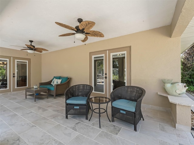 view of patio / terrace featuring ceiling fan and french doors