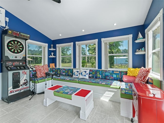 recreation room with lofted ceiling, a wealth of natural light, and recessed lighting