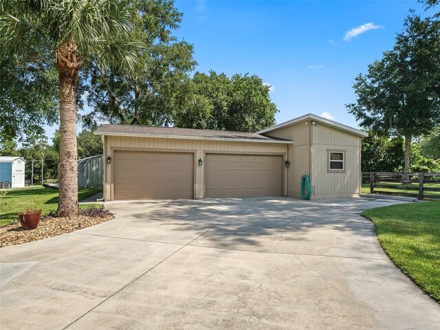 view of front of home with a garage and a front yard