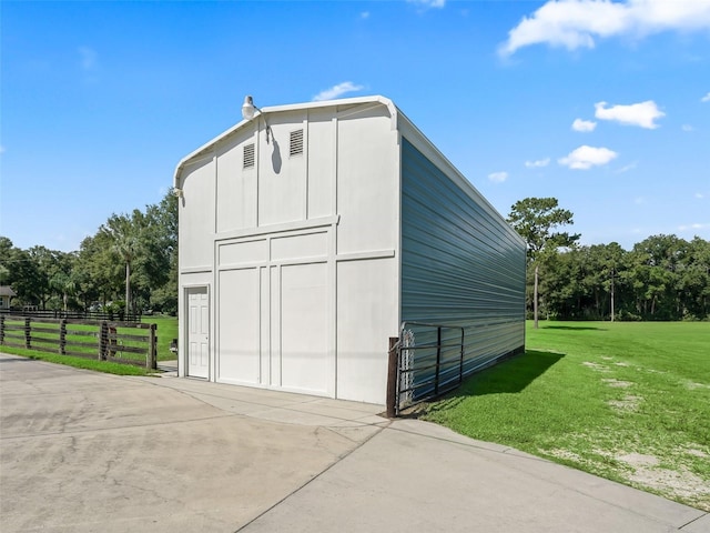 view of outbuilding featuring a yard and a garage