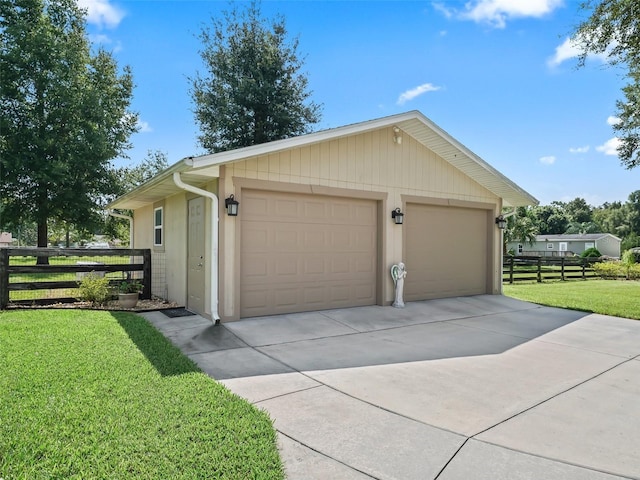 detached garage featuring fence