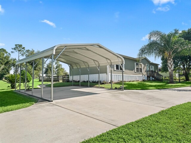 view of parking featuring a lawn and a carport