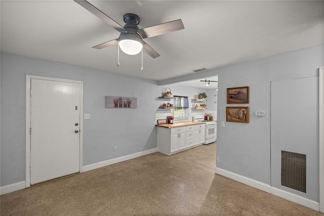 interior space featuring ceiling fan