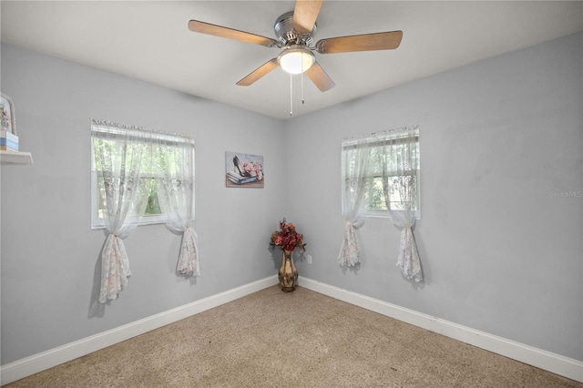 carpeted empty room with ceiling fan