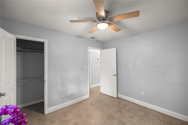 unfurnished bedroom with a closet, ceiling fan, and light colored carpet