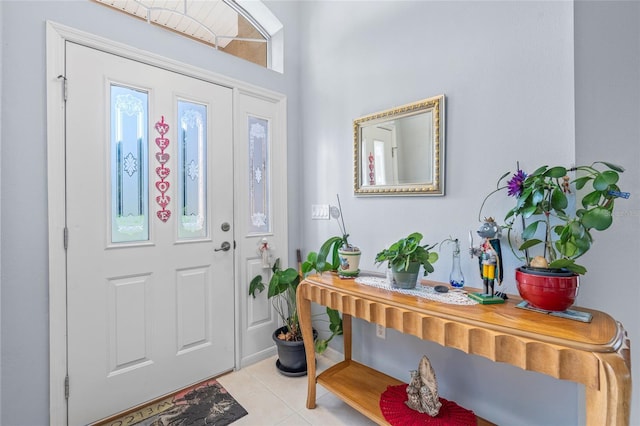 foyer entrance featuring light tile patterned floors