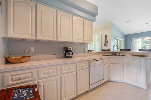 kitchen with hanging light fixtures, white dishwasher, sink, lofted ceiling, and light tile patterned flooring