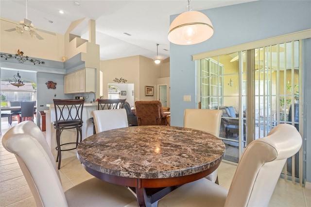 dining space featuring high vaulted ceiling, light tile patterned floors, and ceiling fan