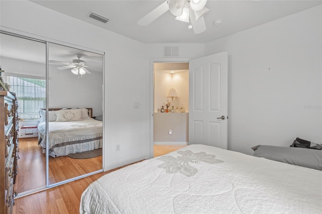 bedroom featuring a closet, ceiling fan, and light hardwood / wood-style flooring