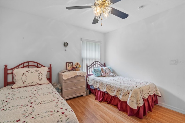 bedroom with ceiling fan and light hardwood / wood-style floors