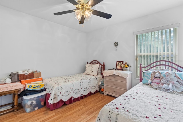 bedroom featuring light wood-type flooring and ceiling fan