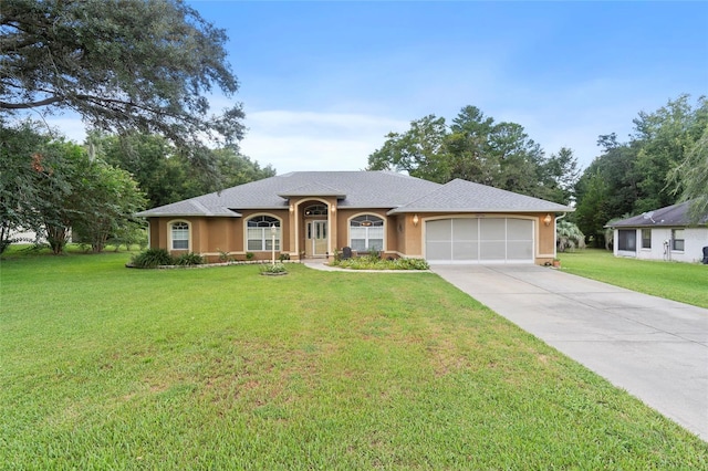 ranch-style home with a front yard and a garage