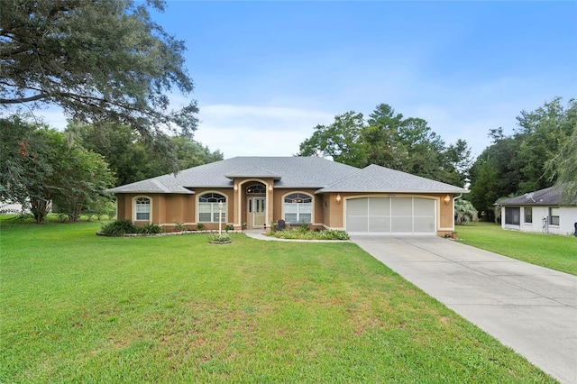 single story home with a front yard and a garage