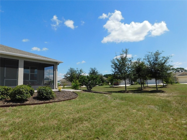 view of yard with a sunroom