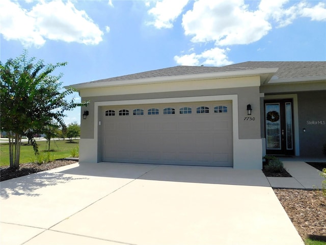 exterior space featuring a garage and a front lawn