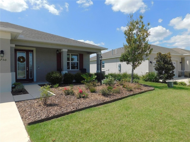 view of front facade with a garage and a front lawn