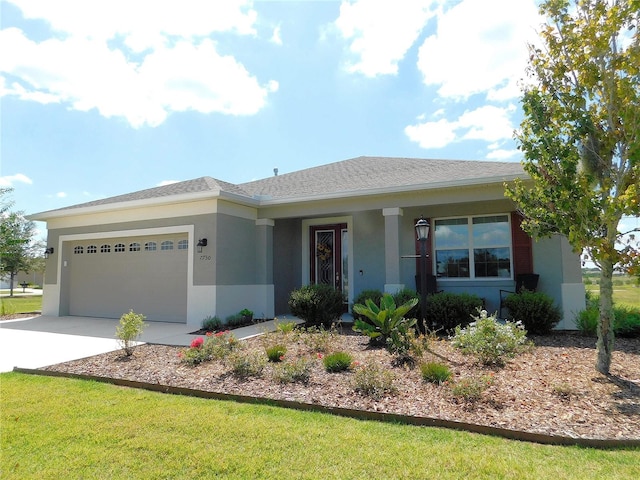 single story home featuring a garage and a front lawn