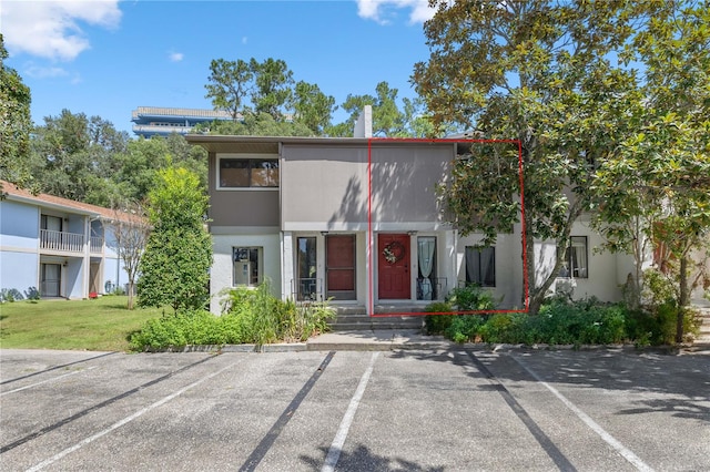 view of front of home featuring a balcony