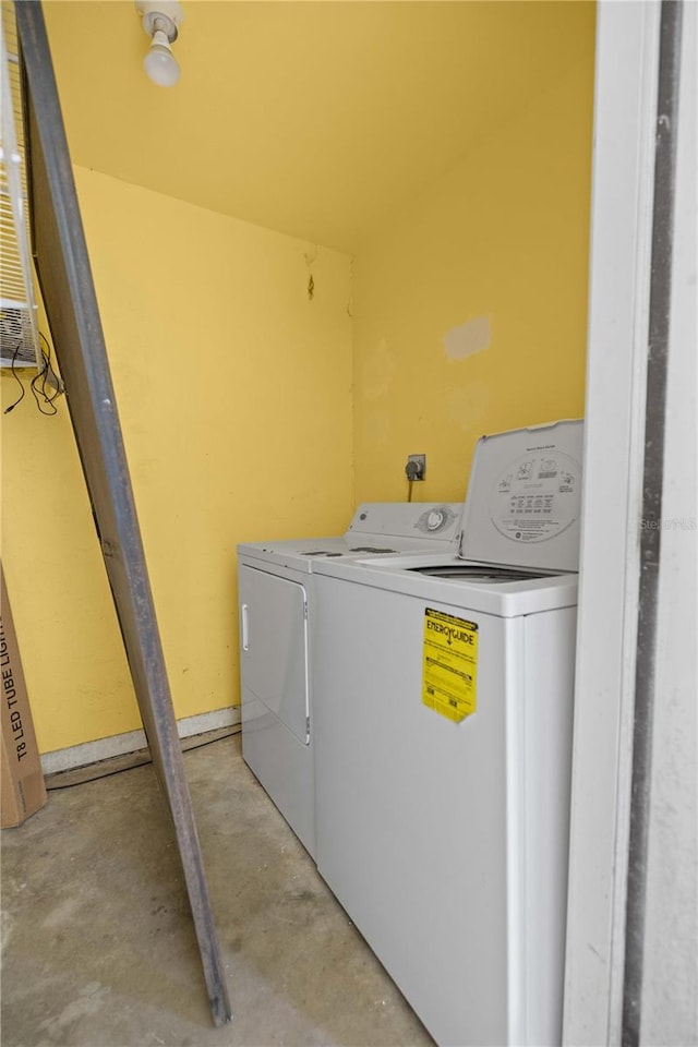 clothes washing area with washer and dryer