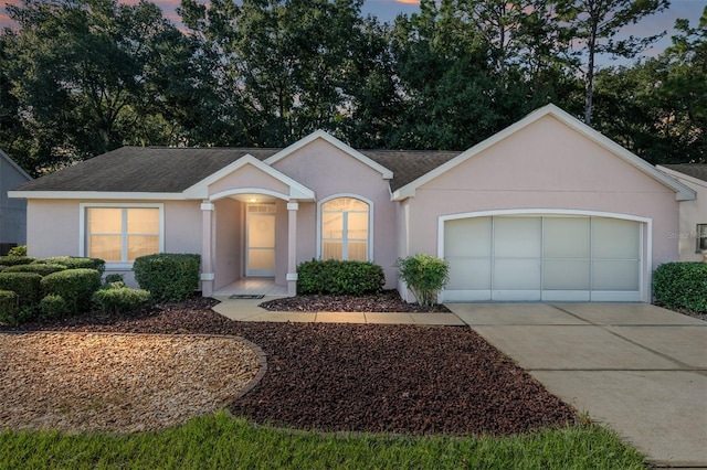 ranch-style home with a garage