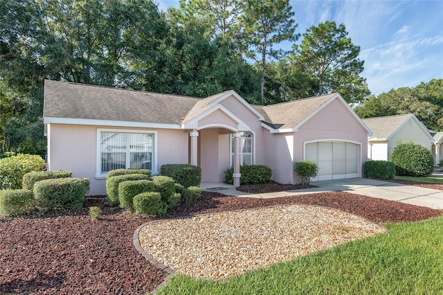 11696 SW 71st Cir, Ocala, FL 34476 - ranch-style home featuring a garage, driveway, a shingled roof, and stucco siding
