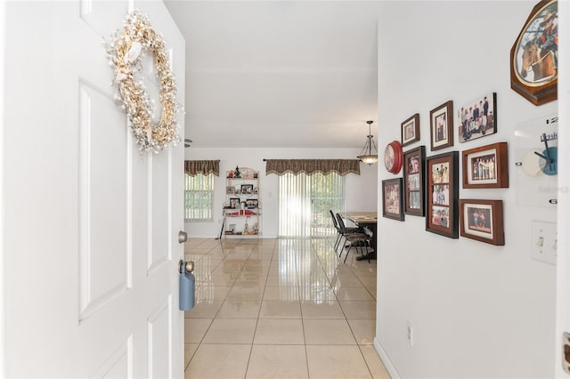 hallway featuring light tile patterned floors