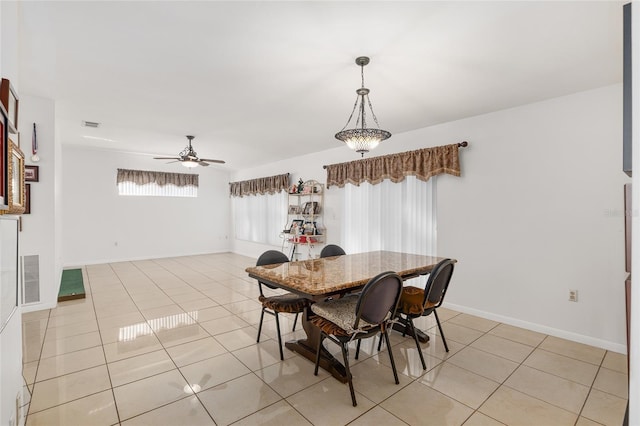 tiled dining area featuring ceiling fan