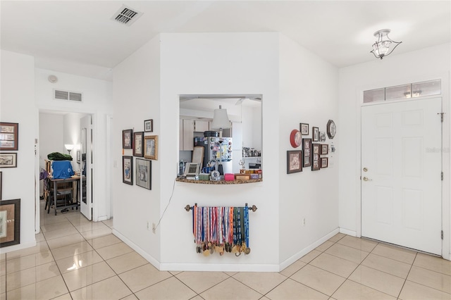 view of tiled foyer entrance