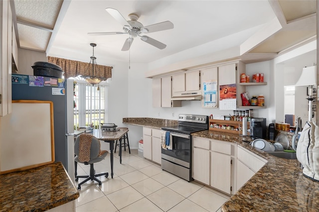 kitchen with white cabinets, light tile patterned floors, and stainless steel range with electric cooktop