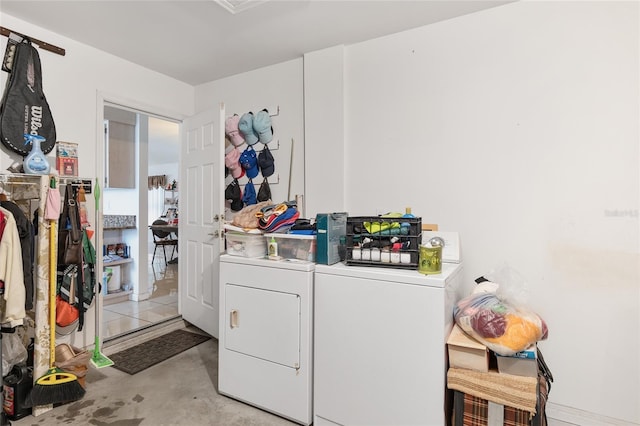 laundry room featuring washing machine and clothes dryer