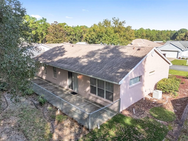 11696 SW 71st Cir, Ocala, FL 34476 - view of front of home featuring roof with shingles, stucco siding, and central AC unit