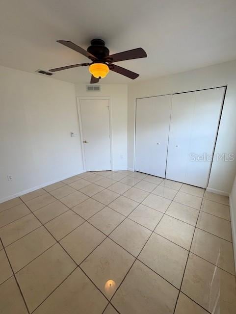 11696 SW 71st Cir, Ocala, FL 34476 - unfurnished bedroom with light tile patterned floors, a closet, and ceiling fan
