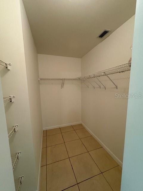 11696 SW 71st Cir, Ocala, FL 34476 - spacious closet with light tile patterned flooring