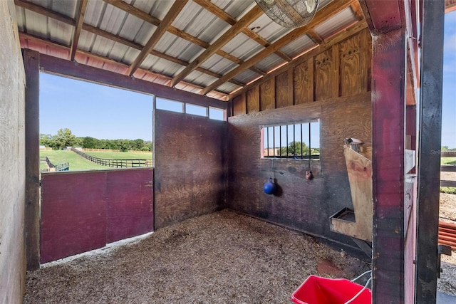 view of stable with a rural view