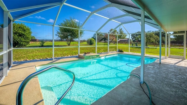 view of pool featuring a lanai, a patio area, and a yard