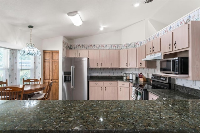 kitchen with light brown cabinetry, pendant lighting, vaulted ceiling, and appliances with stainless steel finishes