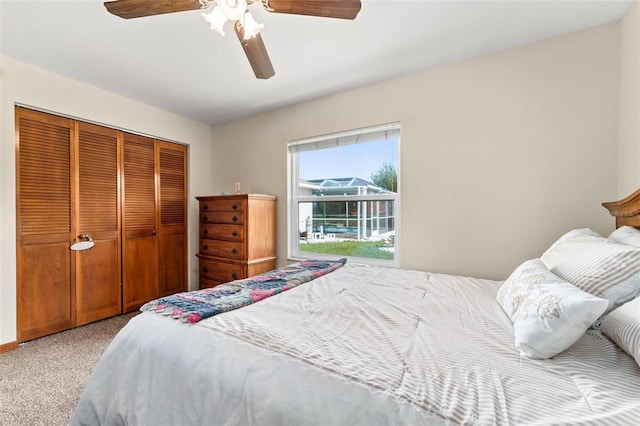 bedroom featuring carpet flooring, a closet, and ceiling fan