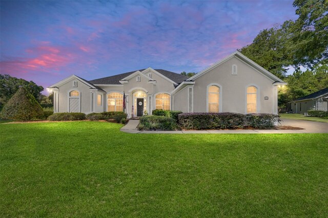 ranch-style house with a yard