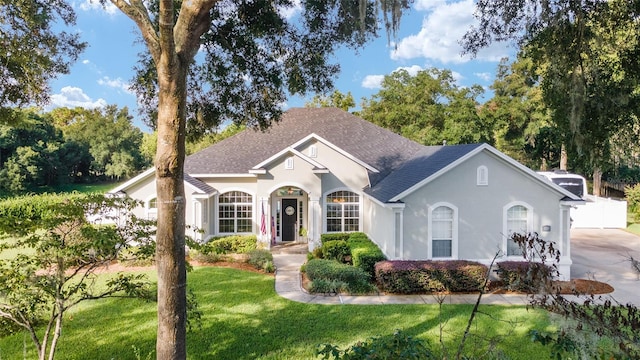 ranch-style house with a front lawn