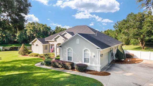 view of front of home with a garage and a front yard