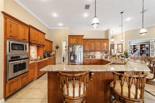 kitchen featuring tasteful backsplash, a breakfast bar area, appliances with stainless steel finishes, and light tile patterned floors