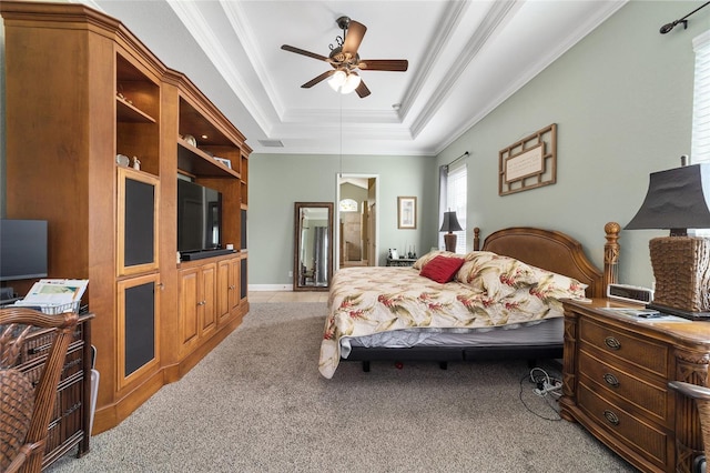 bedroom with ceiling fan, a raised ceiling, crown molding, and light carpet