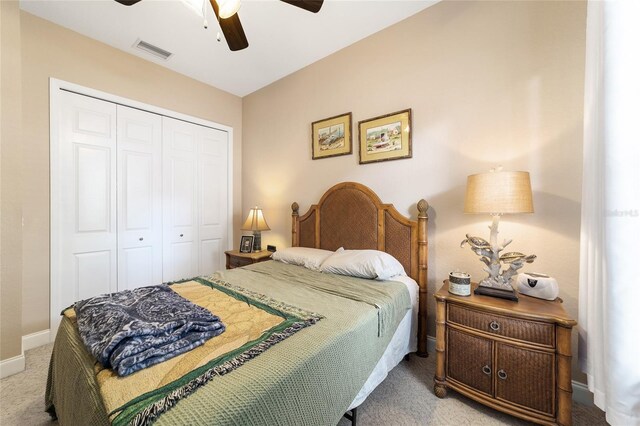 bedroom featuring carpet, a closet, and ceiling fan