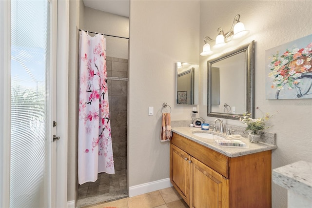 bathroom with vanity, walk in shower, and tile patterned floors