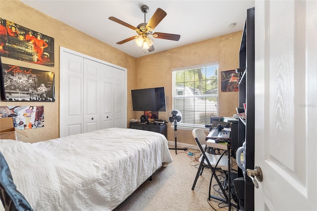 bedroom featuring ceiling fan, a closet, and carpet floors