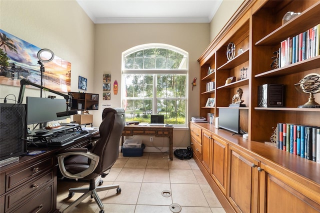 office space featuring a wealth of natural light, ornamental molding, and light tile patterned floors