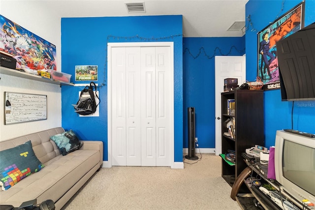 carpeted bedroom with a closet