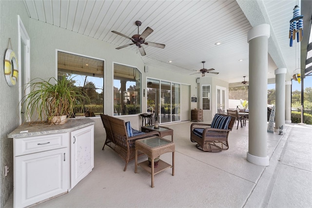 view of patio with ceiling fan and an outdoor hangout area