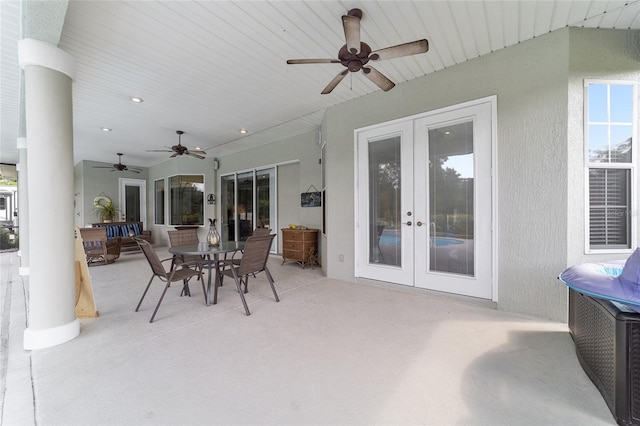 view of patio with ceiling fan and french doors