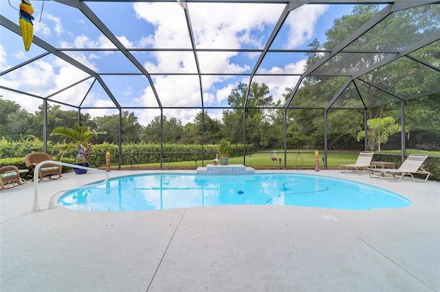 view of pool with a lanai and a patio